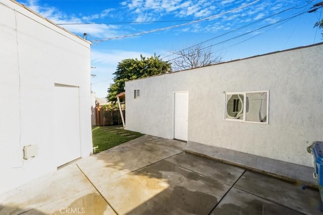 view of side of home featuring a patio