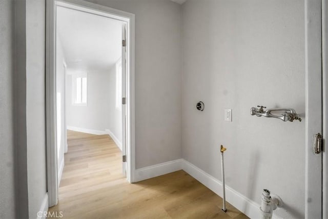 washroom with light hardwood / wood-style floors