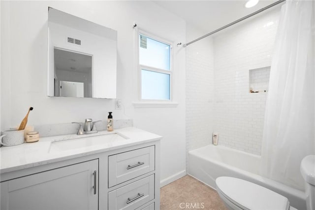 full bathroom with toilet, vanity, and shower / tub combo