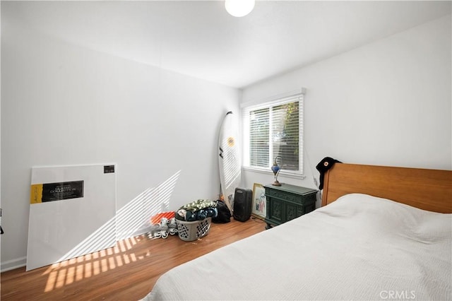 bedroom featuring hardwood / wood-style floors