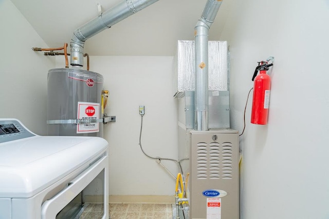 laundry room with washer / clothes dryer and water heater