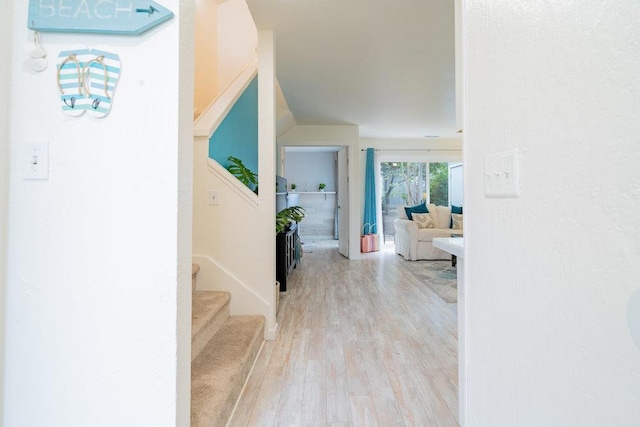 hall with light hardwood / wood-style floors