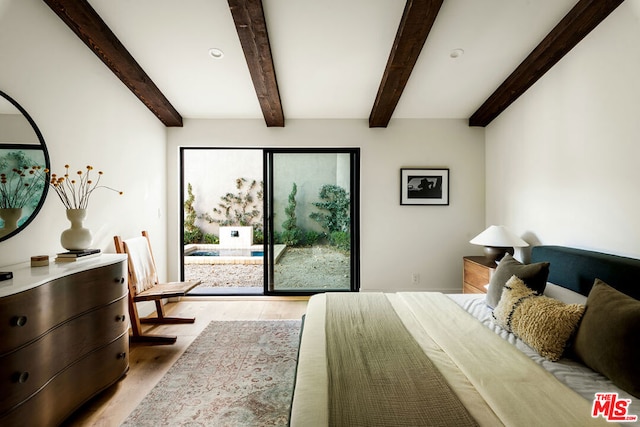 bedroom featuring light wood-type flooring and beam ceiling