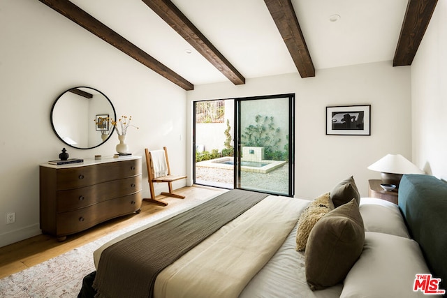 bedroom with beam ceiling, light hardwood / wood-style floors, and access to outside