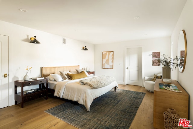 bedroom featuring wood-type flooring