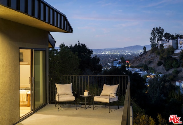 exterior space with a mountain view and a balcony