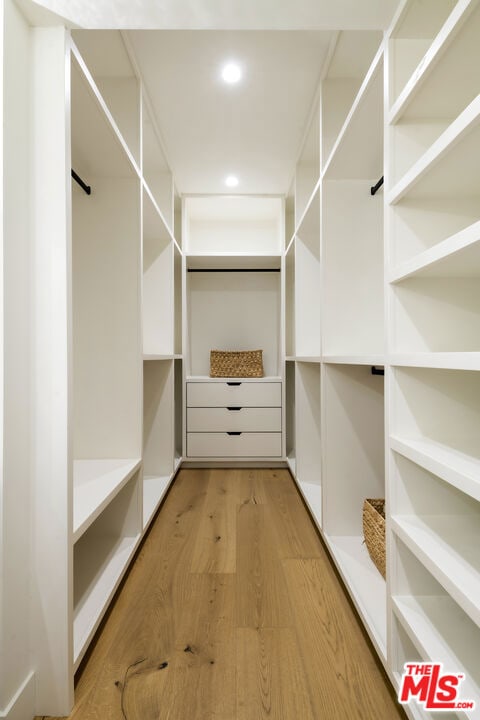 spacious closet featuring light wood-type flooring