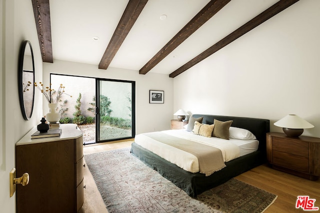 bedroom featuring access to exterior, beamed ceiling, and wood-type flooring