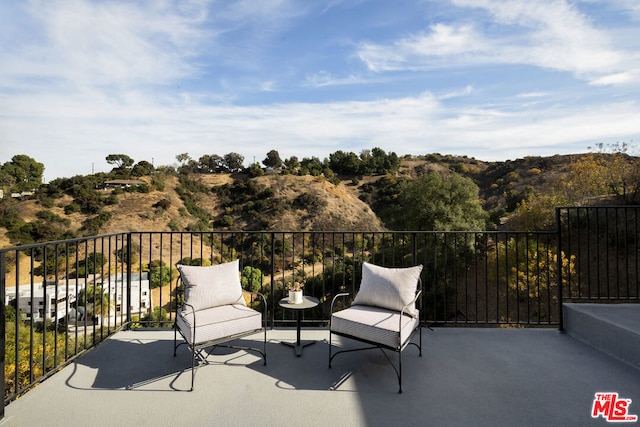 view of patio with a balcony