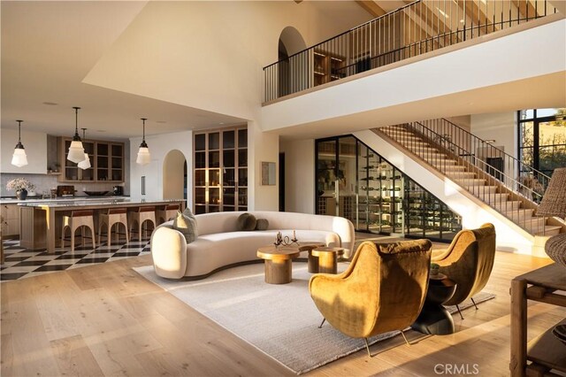 interior space featuring a high ceiling and light hardwood / wood-style flooring