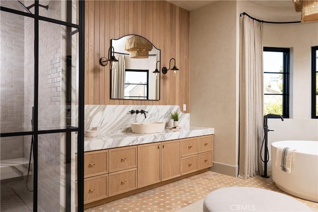 bathroom with wooden walls, a bathtub, and vanity