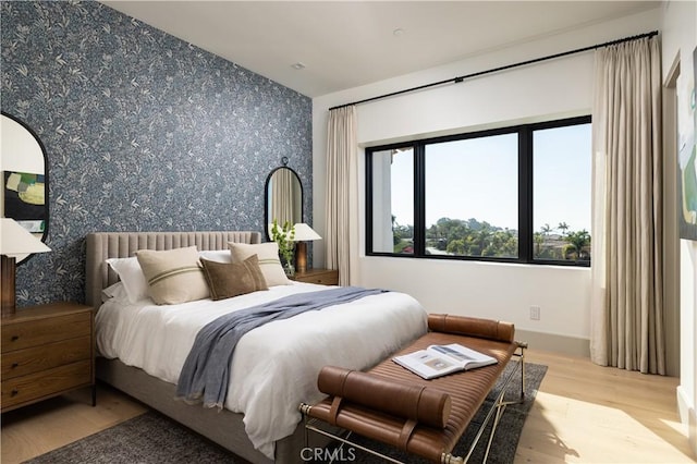 bedroom with light hardwood / wood-style flooring