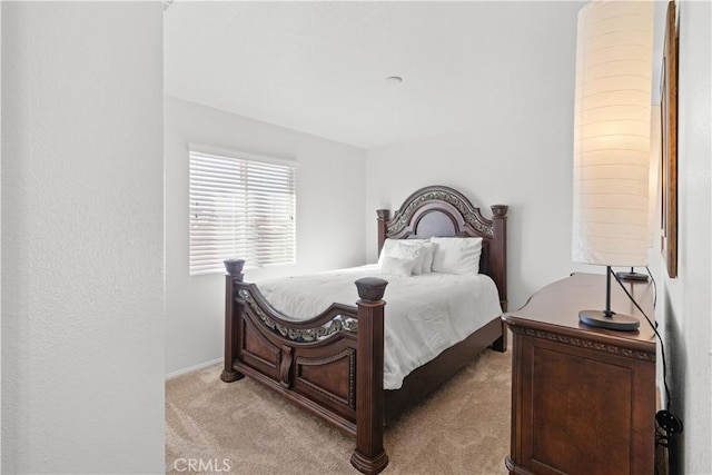 bedroom with light carpet