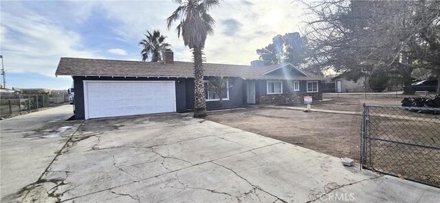 single story home featuring a garage