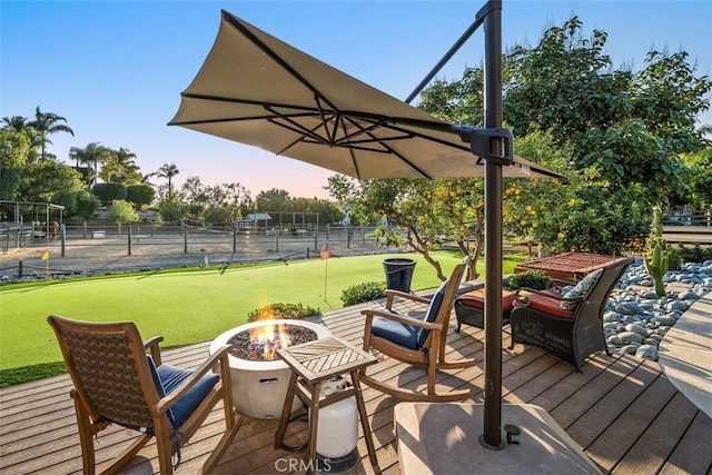 deck featuring an outdoor fire pit