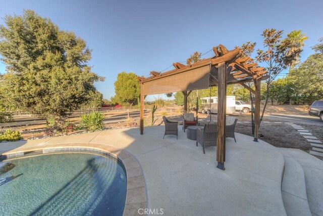 view of pool featuring a patio area and a pergola