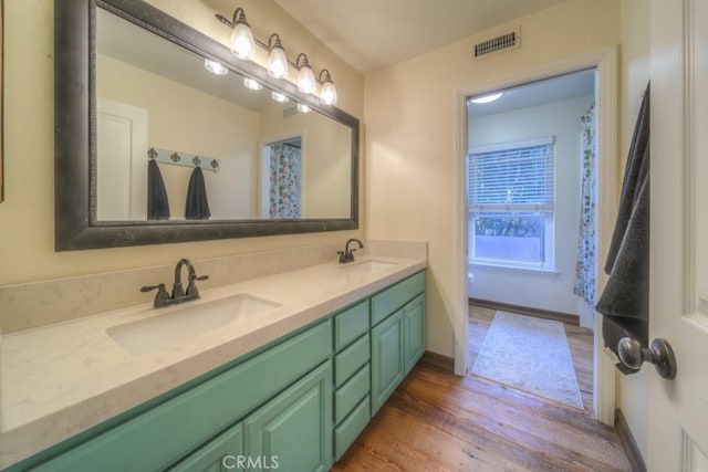 bathroom featuring hardwood / wood-style floors and vanity