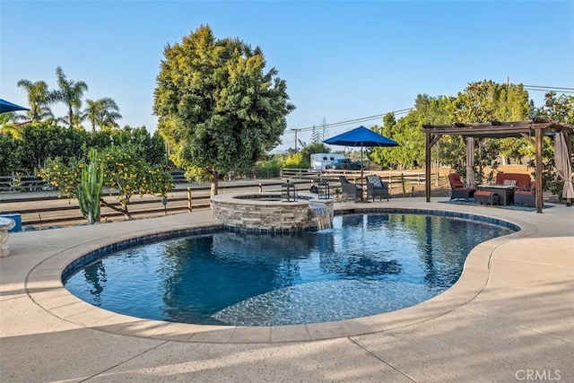 view of swimming pool featuring a patio area, an in ground hot tub, and a pergola