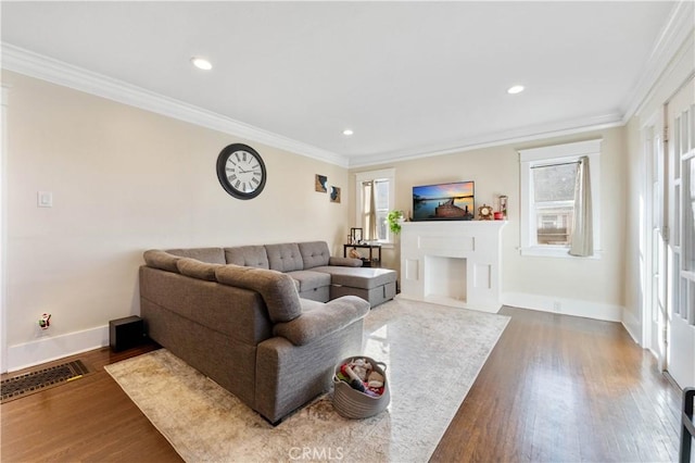 living room with dark hardwood / wood-style flooring and ornamental molding