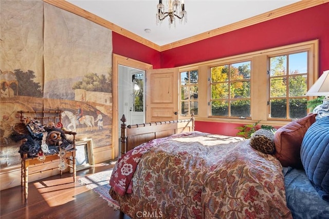 bedroom with a chandelier, crown molding, hardwood / wood-style flooring, and multiple windows