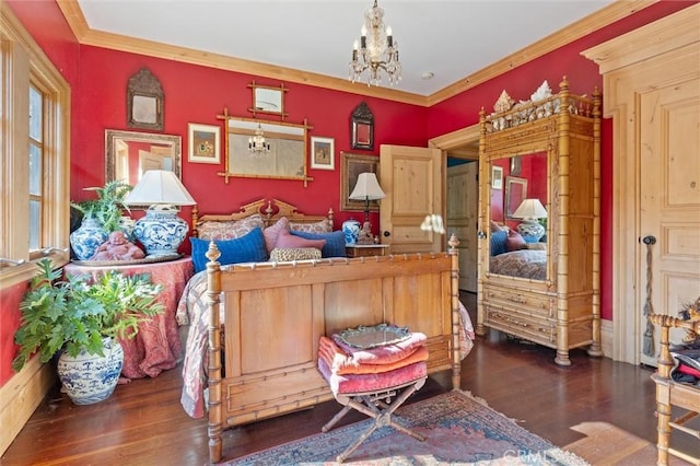 bedroom featuring crown molding, dark hardwood / wood-style floors, and an inviting chandelier