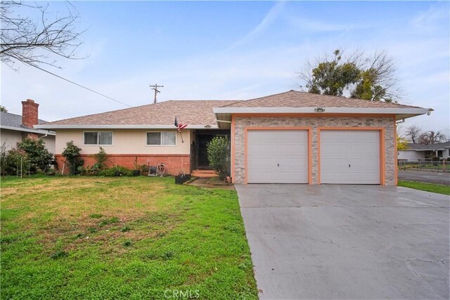 single story home with a front lawn and a garage