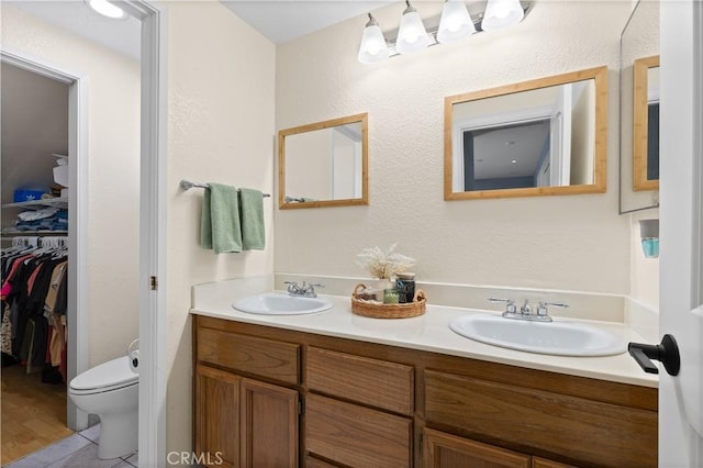 bathroom with toilet and vanity