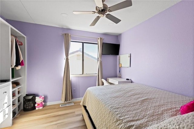 bedroom featuring ceiling fan and light hardwood / wood-style flooring