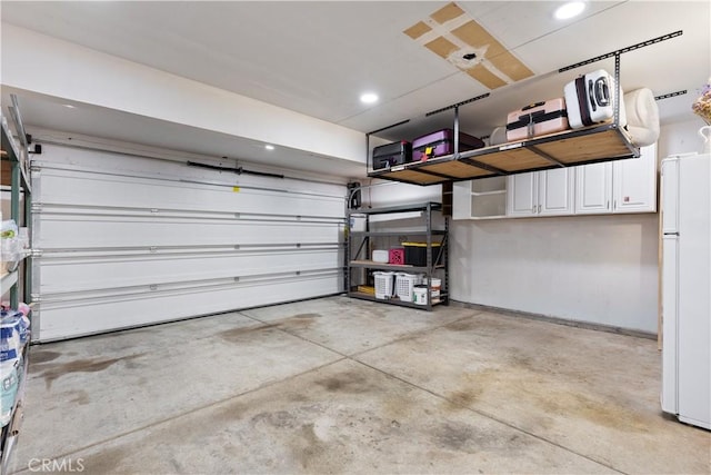 garage with white refrigerator