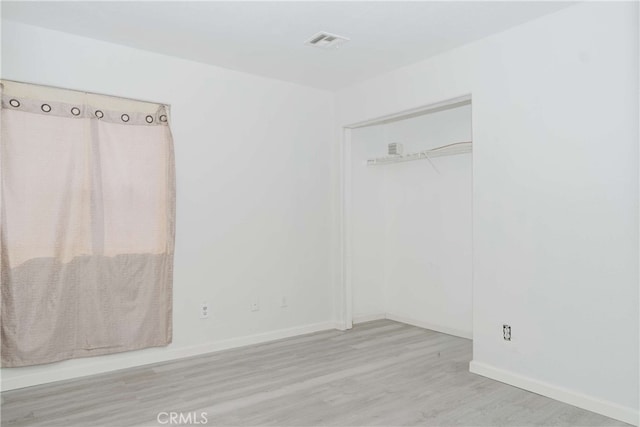 empty room with light wood-type flooring