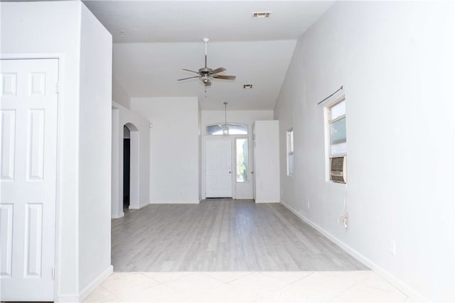 entryway featuring ceiling fan and lofted ceiling