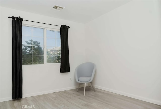 spare room featuring light wood-type flooring