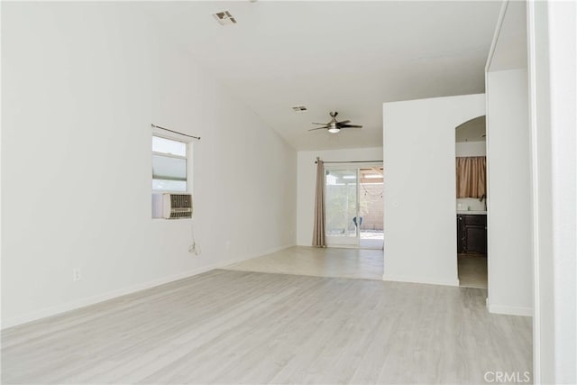 unfurnished room with cooling unit, ceiling fan, and light hardwood / wood-style floors