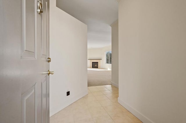 corridor with light tile patterned floors