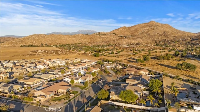 birds eye view of property with a mountain view