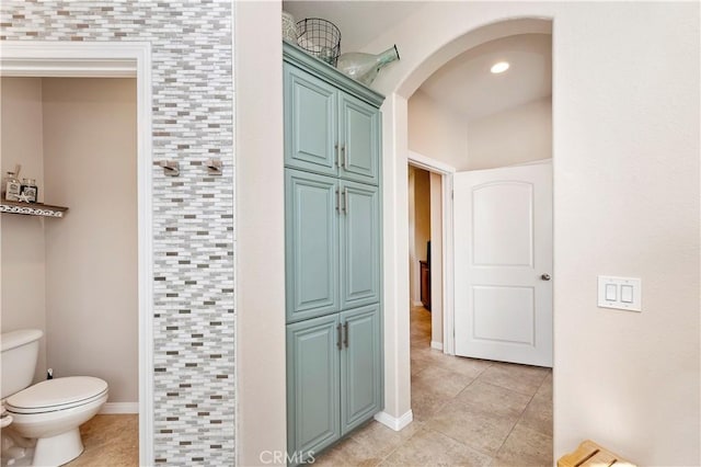 bathroom featuring toilet and tile patterned floors