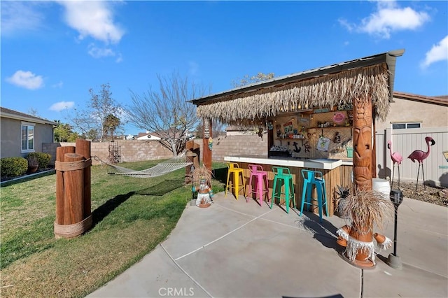 view of patio / terrace featuring an outdoor bar