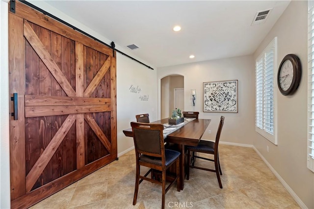 dining room with a barn door