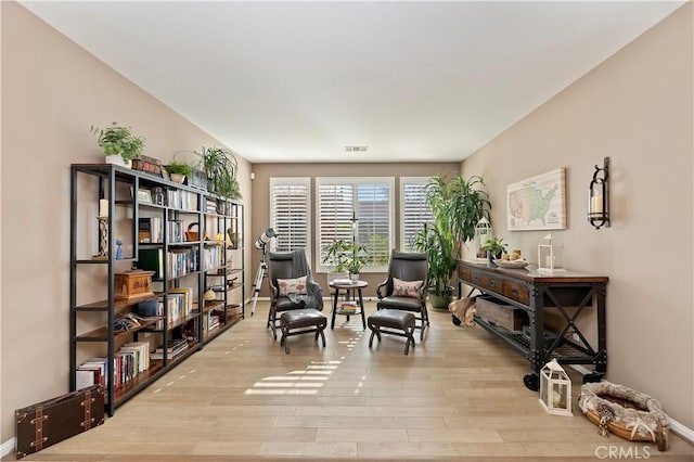 sitting room featuring light wood-type flooring