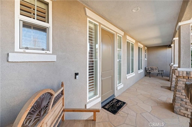 entrance to property with a porch