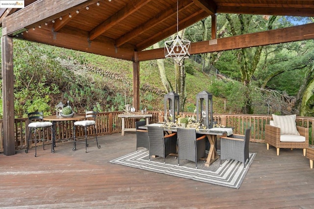 wooden terrace featuring a gazebo