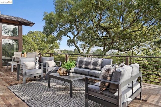 wooden terrace featuring an outdoor hangout area