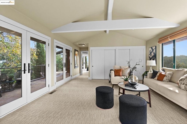 sunroom / solarium featuring vaulted ceiling with beams and french doors