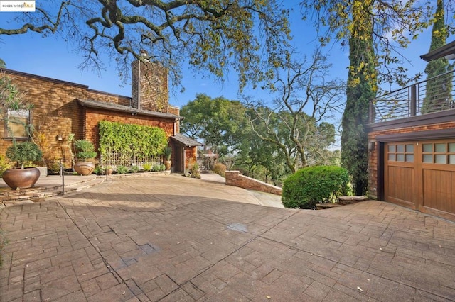 view of patio / terrace featuring a garage