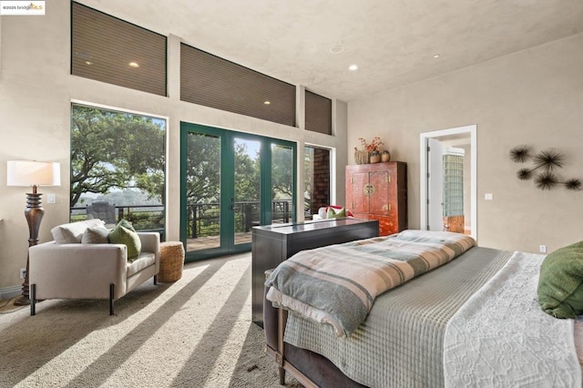 carpeted bedroom with multiple windows, access to outside, and french doors