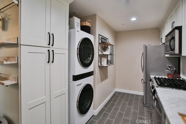 laundry room featuring stacked washer / dryer