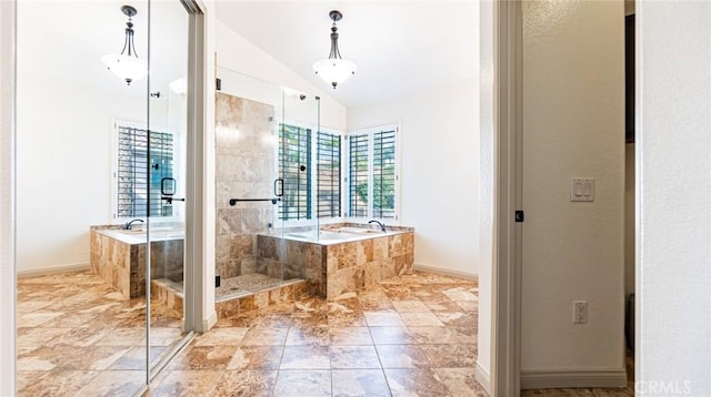 bathroom featuring vaulted ceiling and independent shower and bath