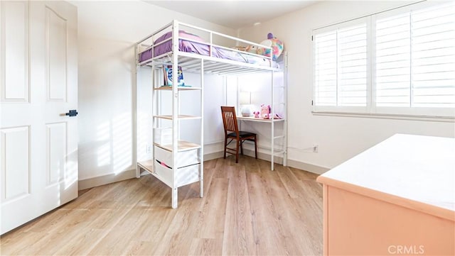 bedroom with light hardwood / wood-style flooring