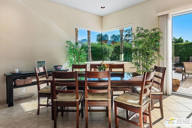 dining room featuring light tile patterned floors