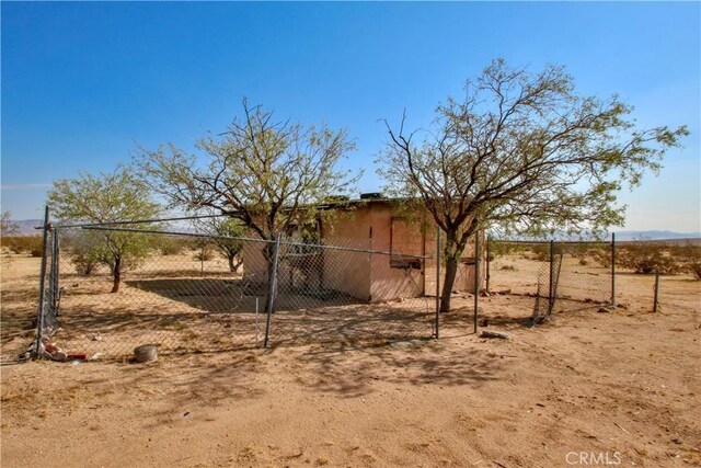 view of yard with a rural view